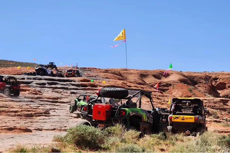 Tri state atv club climbing red rocks with atvs.